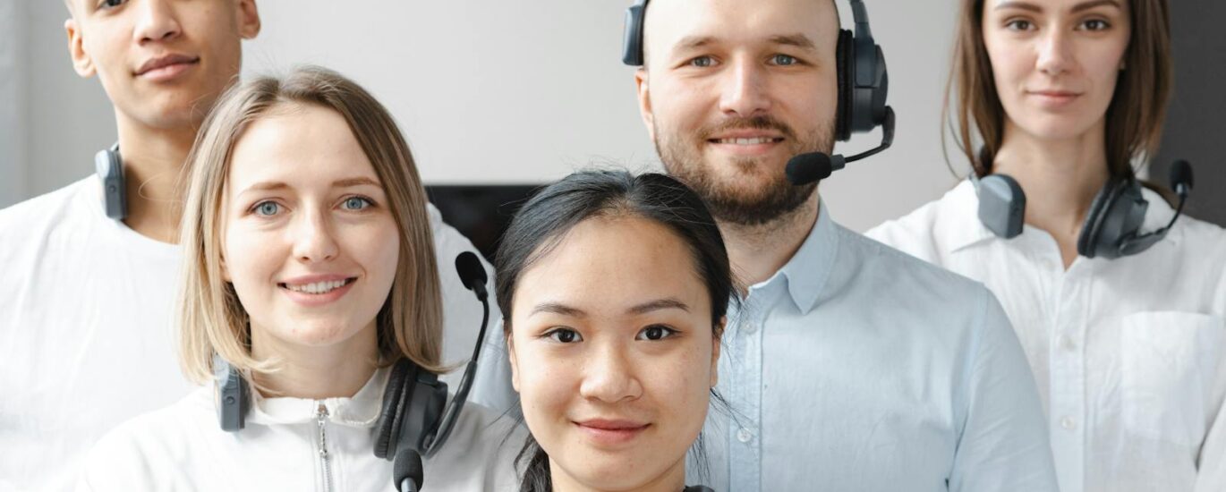 Smiling Call Center Agents Looking at Camera