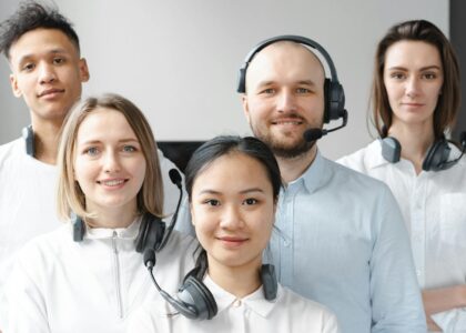 Smiling Call Center Agents Looking at Camera